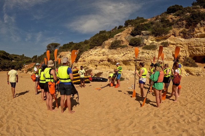 a group of people on a beach